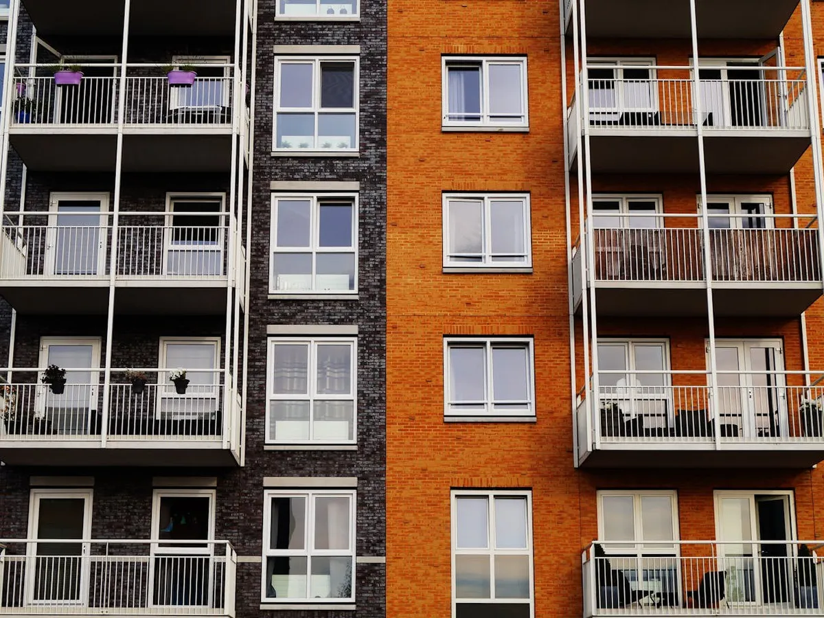Orange and grey brick apartment block front
